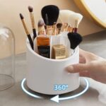 Empty clear acrylic rotating makeup brush holder with dustproof lid placed next to it