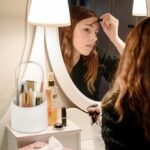 Dustproof lid closed on rotating makeup brush holder keeping brushes clean and hygienic