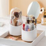 Hand spinning 360 degree rotating makeup brush holder showing smooth rotation access