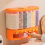 Clear plastic cereal dispenser with airtight lid standing on kitchen counter
