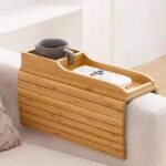 Wooden sofa armrest organizer with remote control and smartphone